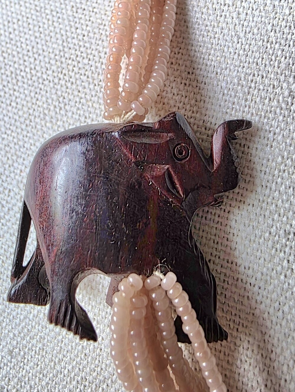 Vintage 1950s or 1960s multi- strand peach beaded necklace with Wood Elephant.
